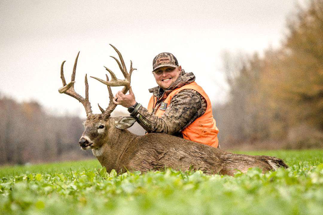 Small Town Hunting co-host Cody Kelley shows off Stickers — a giant Mississippi deer. Image by Small Town Hunting