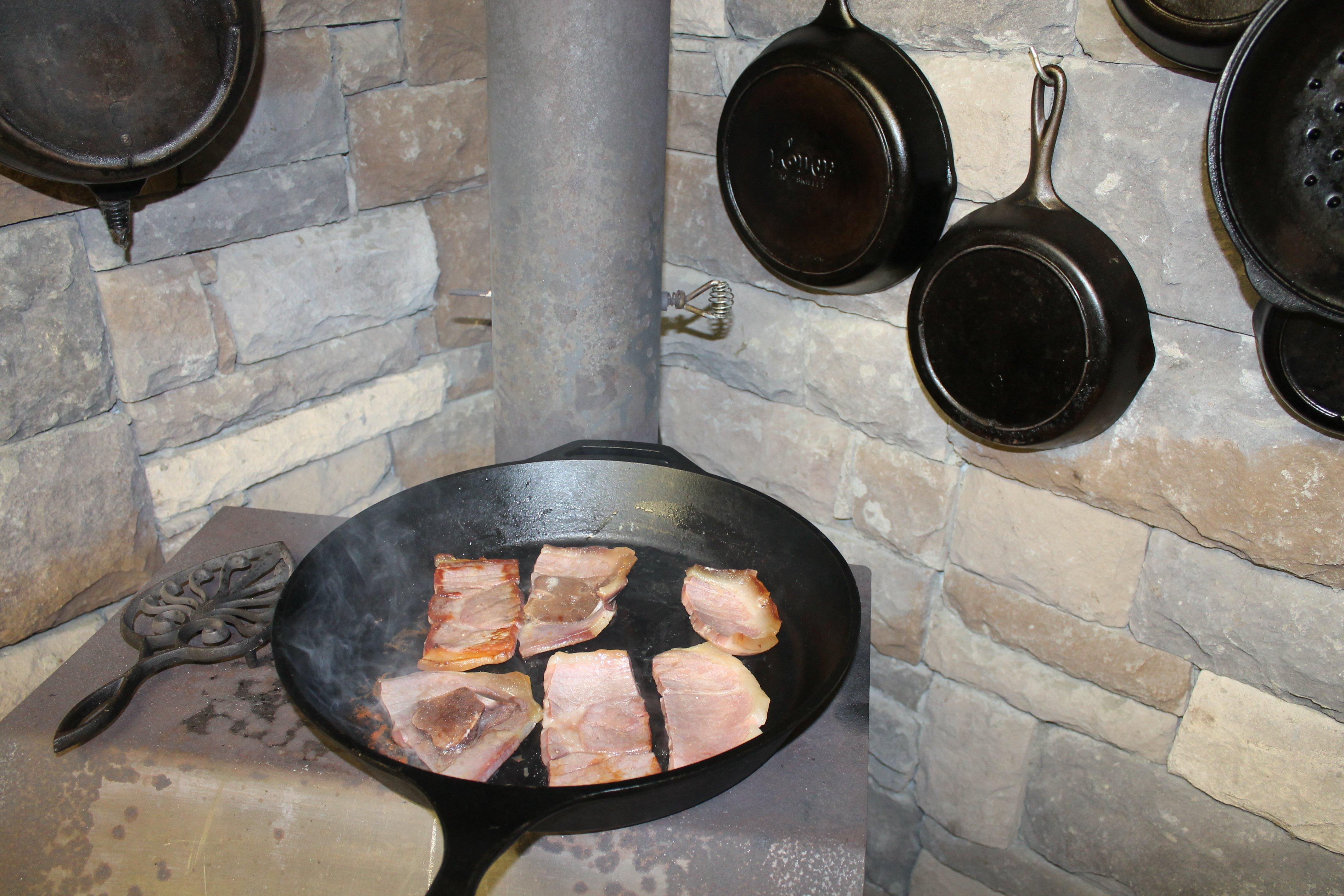 Cast iron is equally at home on the modern cooktop, a campfire, or, like this one, on top of a wood burning stove.
