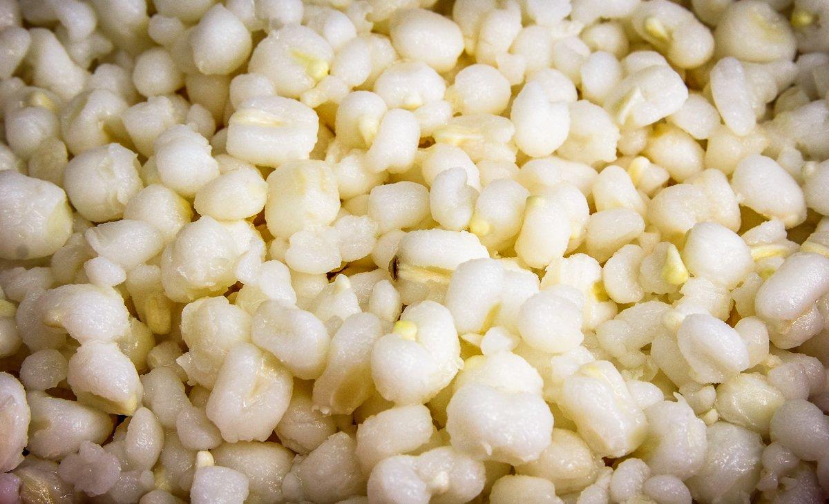 Hominy is simply dried field corn that has been soaked in an alkaline solution causing the outer husk to shed and the inner kernel to swell. 
