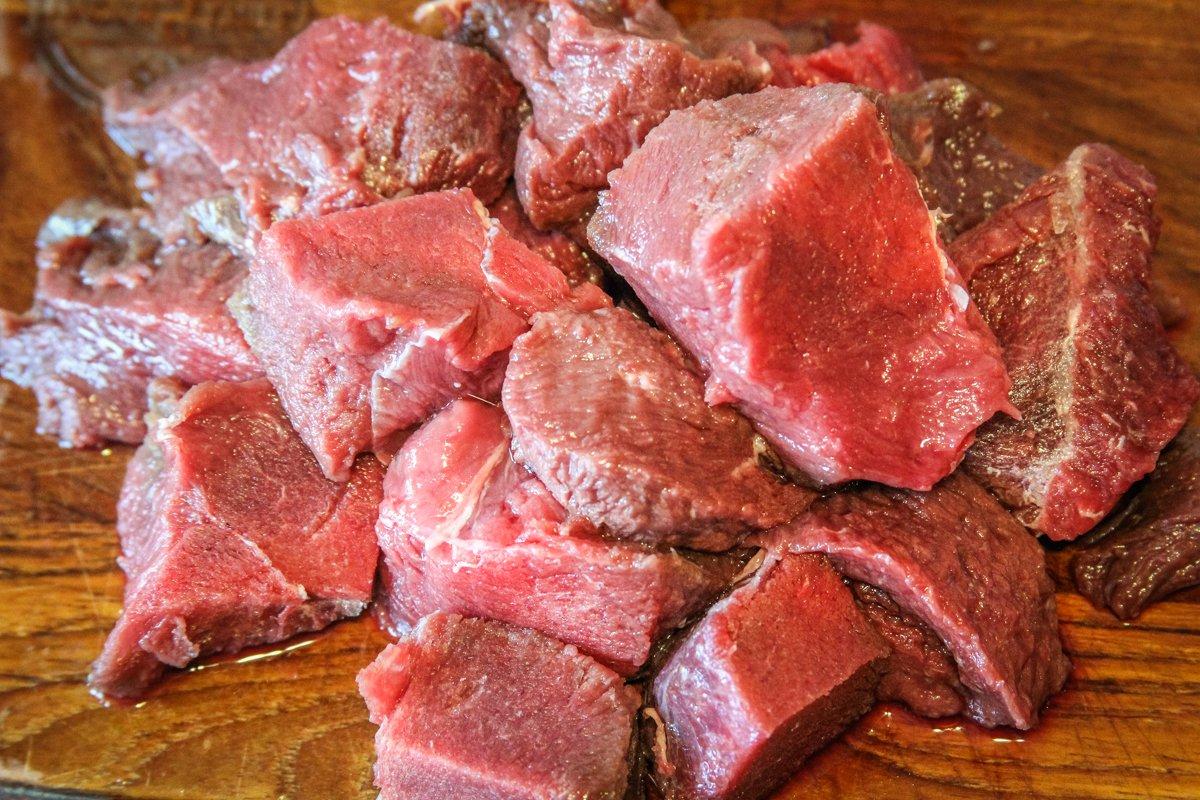 Trim the backstrap and cut it into bite-sized cubes.