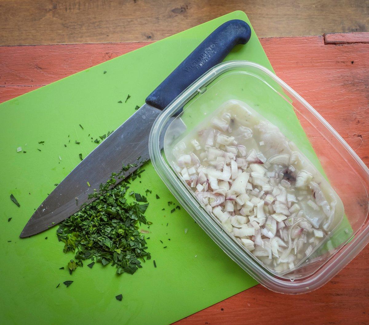 Add the diced shallot, peppers and cilantro to the fish and lime juice.