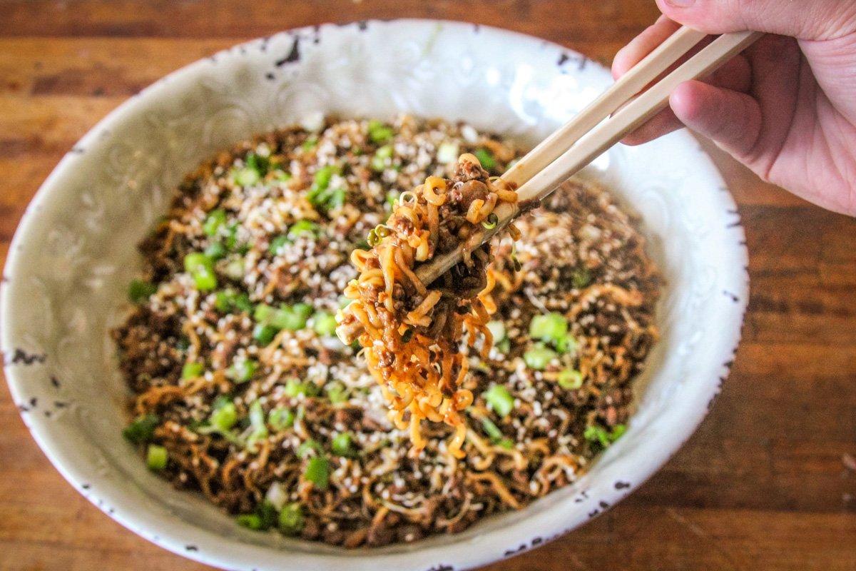 Garnish with diced green onions and sesame seeds.