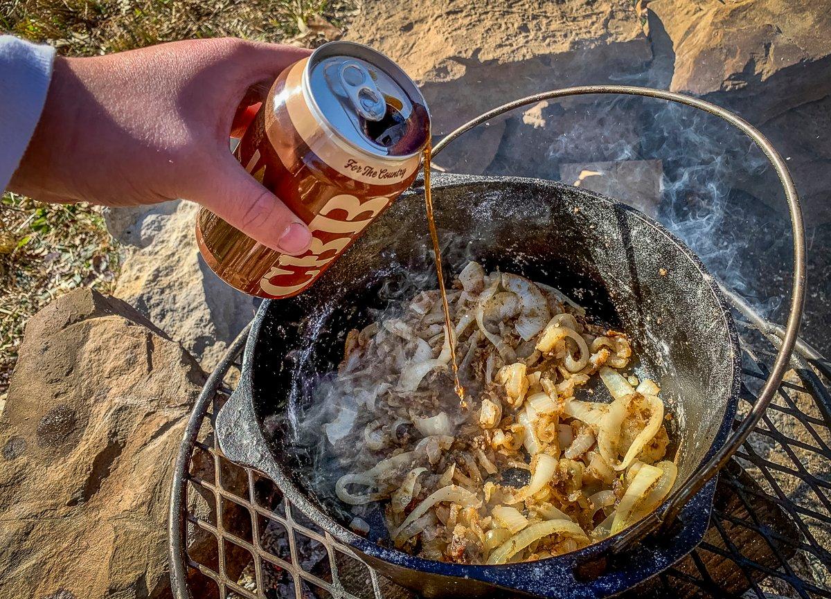 Add a can of your favorite beer or stock to the caramelized onions and flour to form the gravy.