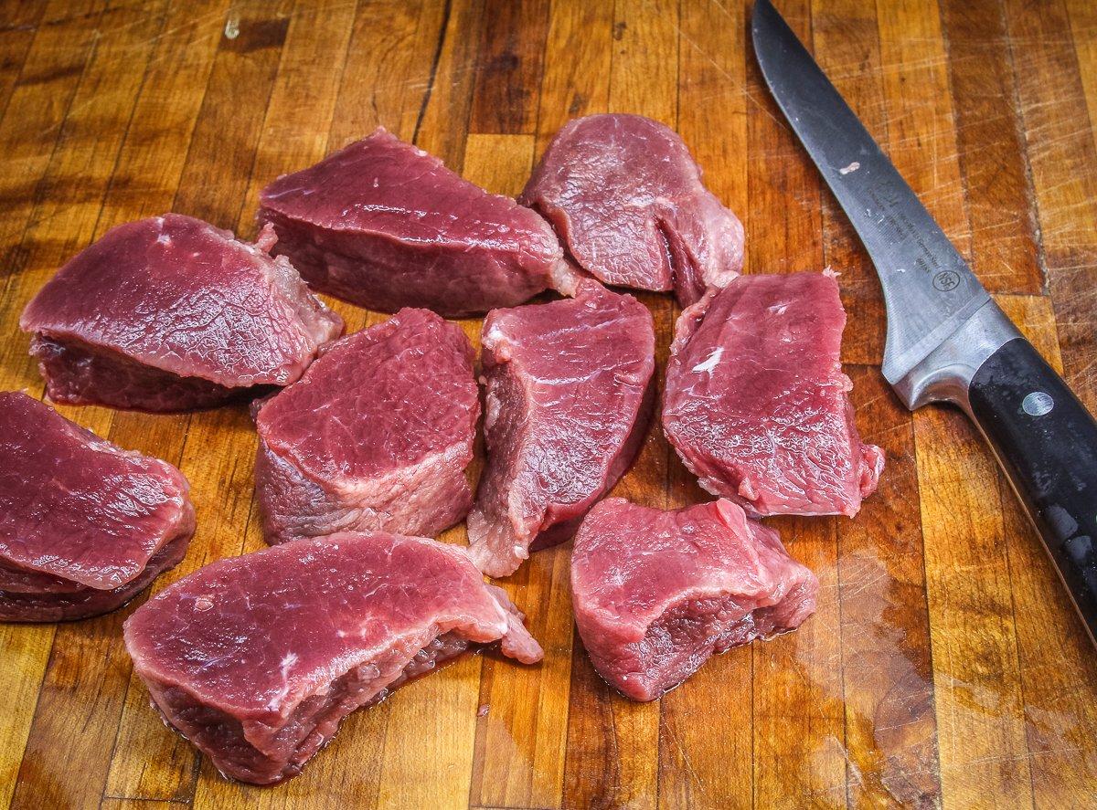 Slice the backstrap into relatively thick steaks to prevent overcooking.