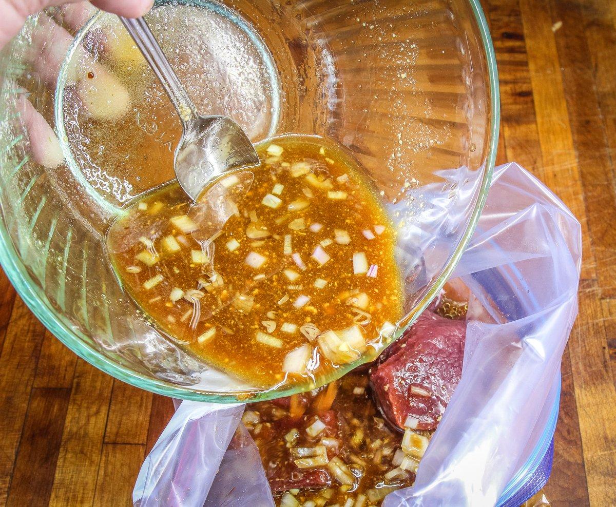 Place the steaks in a zip-style bag and pour over the marinade.