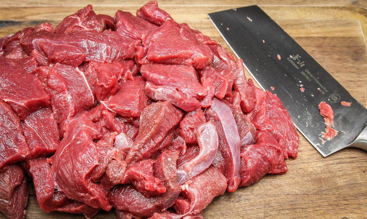 Slice the venison into thin strips making sure to cut across the grain.