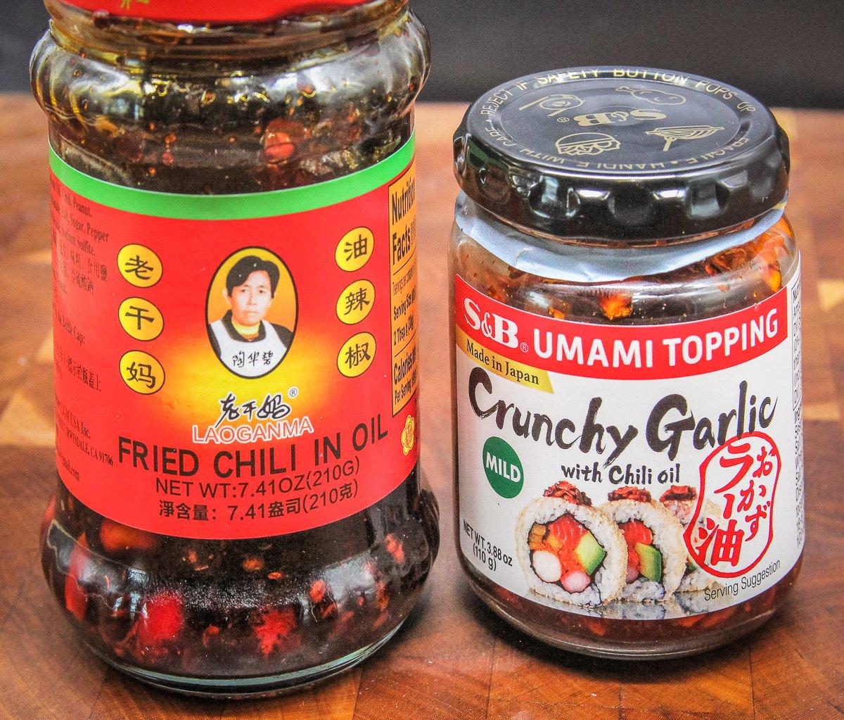 Chili flakes in oil and crispy garlic flakes are available at most Asian groceries or in large supermarkets.