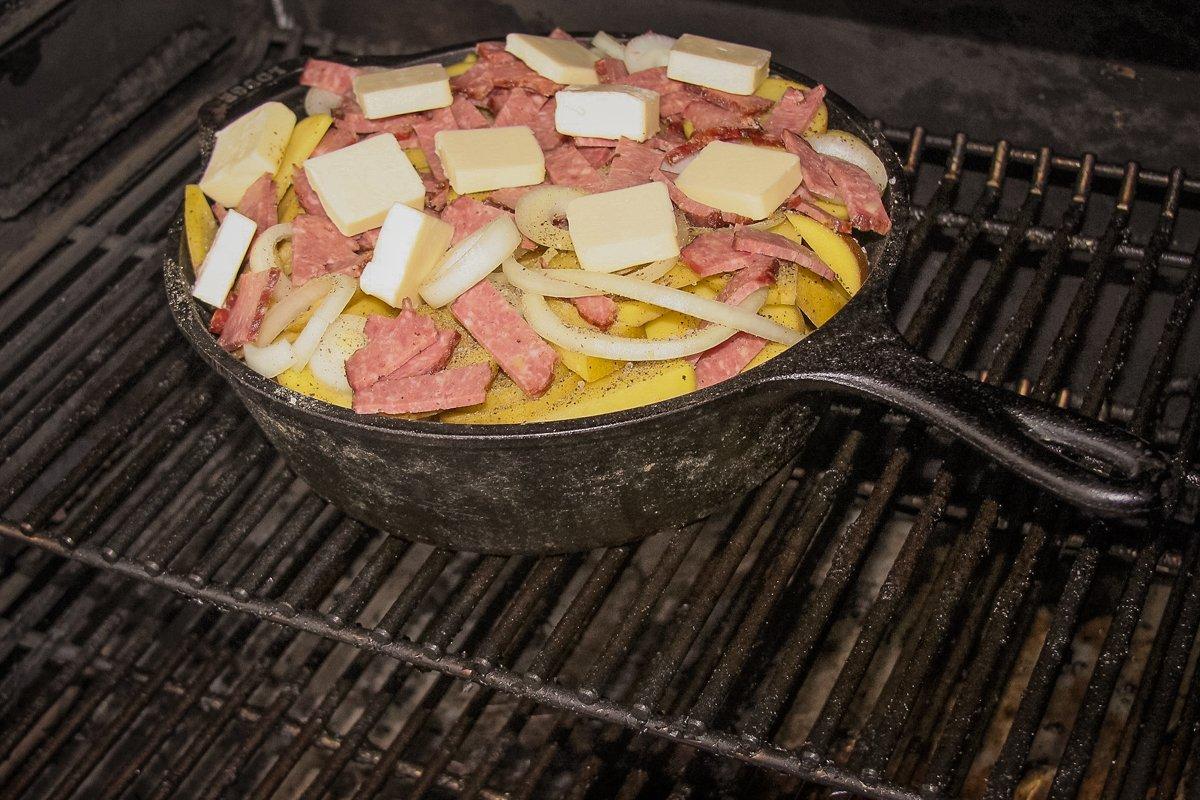 Cook on the grill or over a low campfire until the potatoes are cooked through.