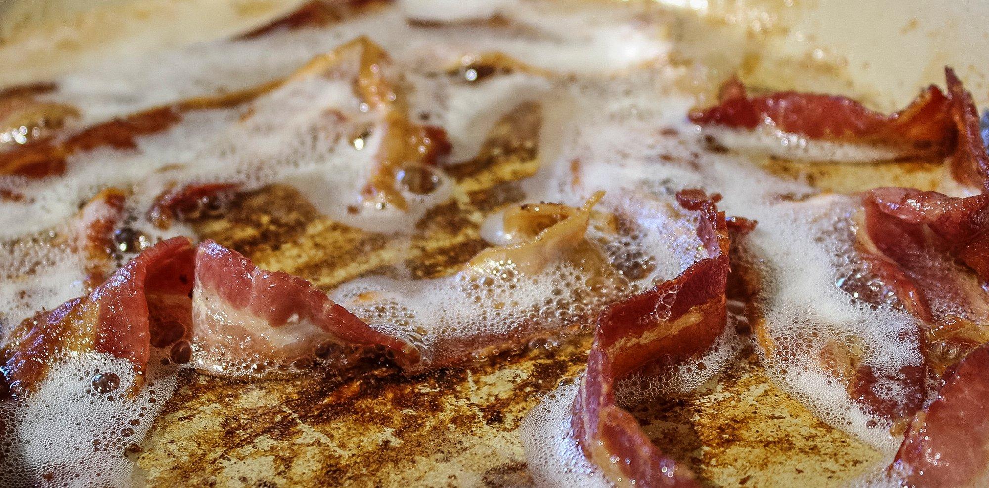 Fry bacon in a heavy skillet.