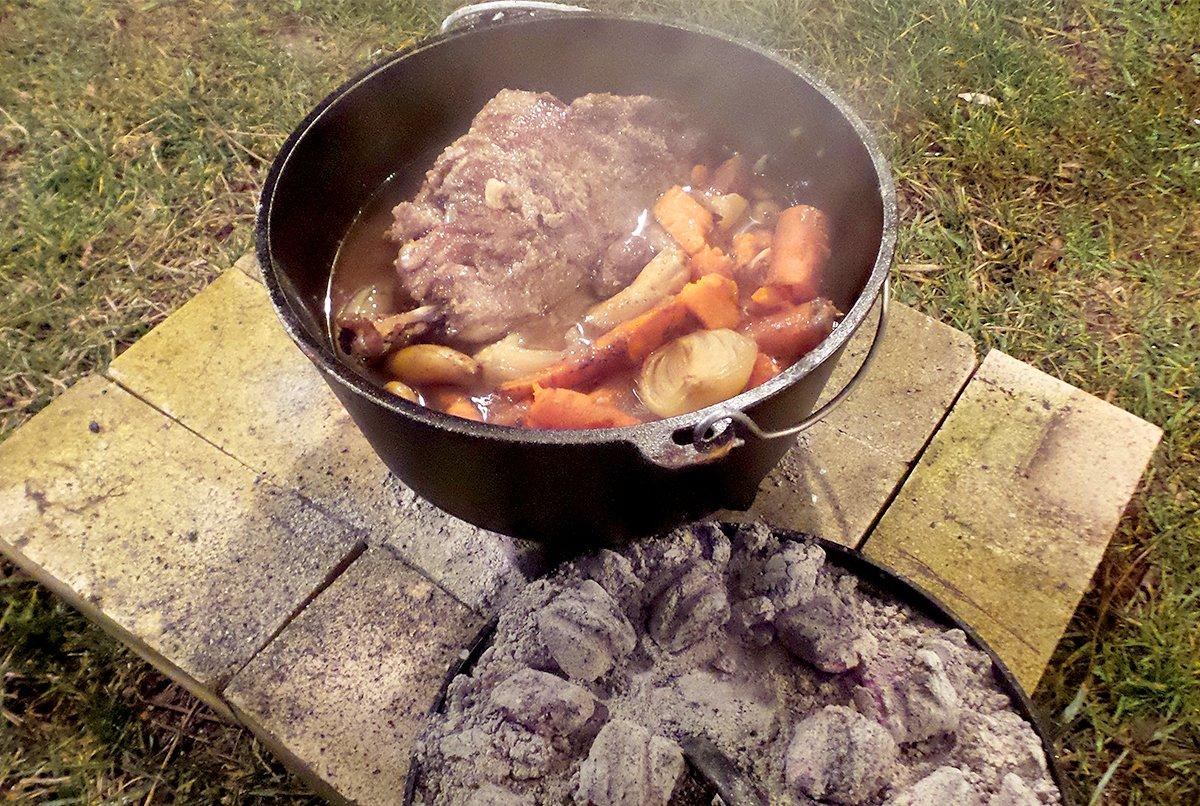 Use charcoal briquettes below and on top of the Dutch oven for a long and slow heat source. 
