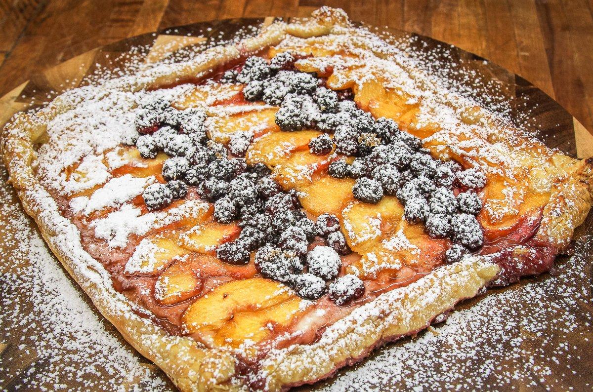 Dust the tart with powdered sugar before serving.