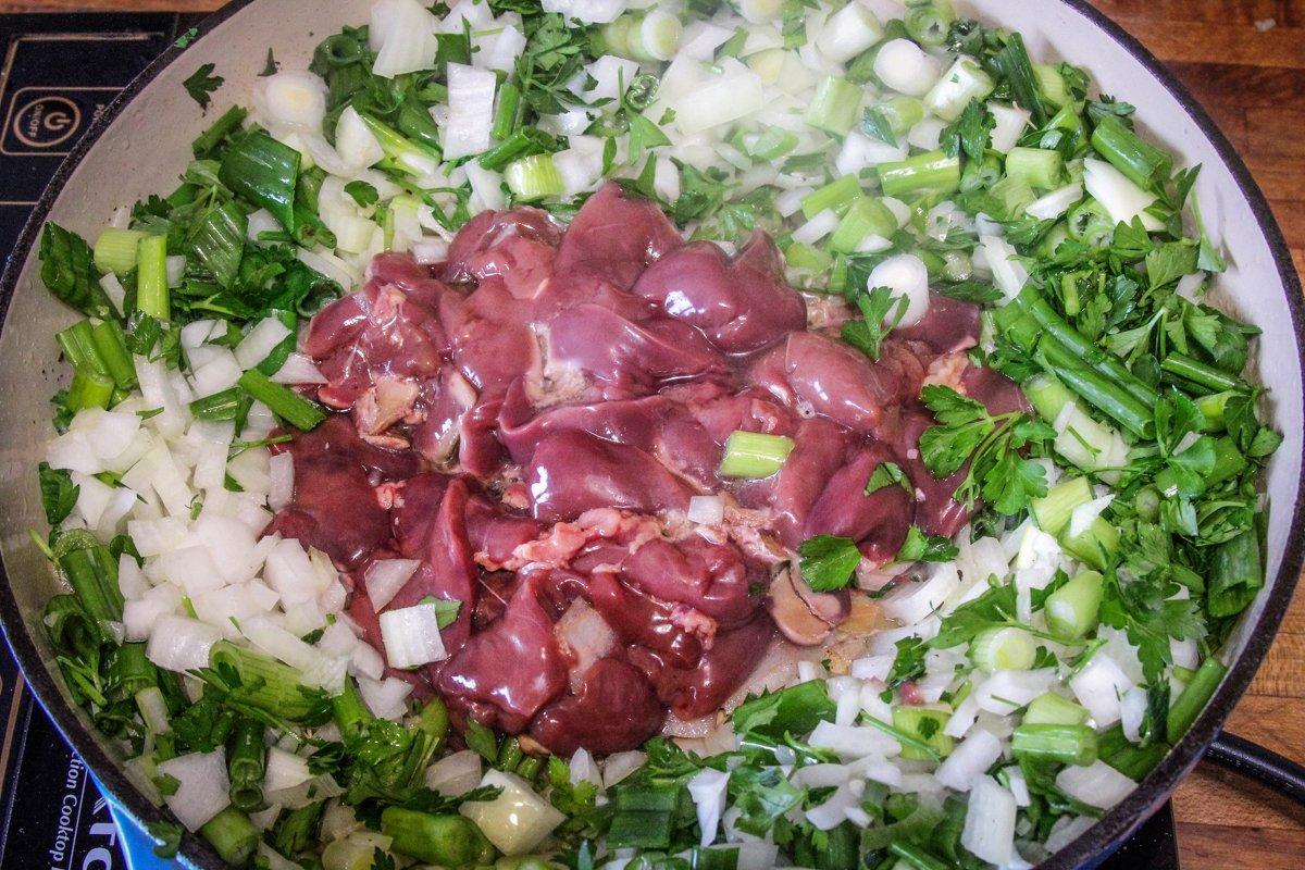 Cook the green onions, chicken liver, and parsley in bacon grease.
