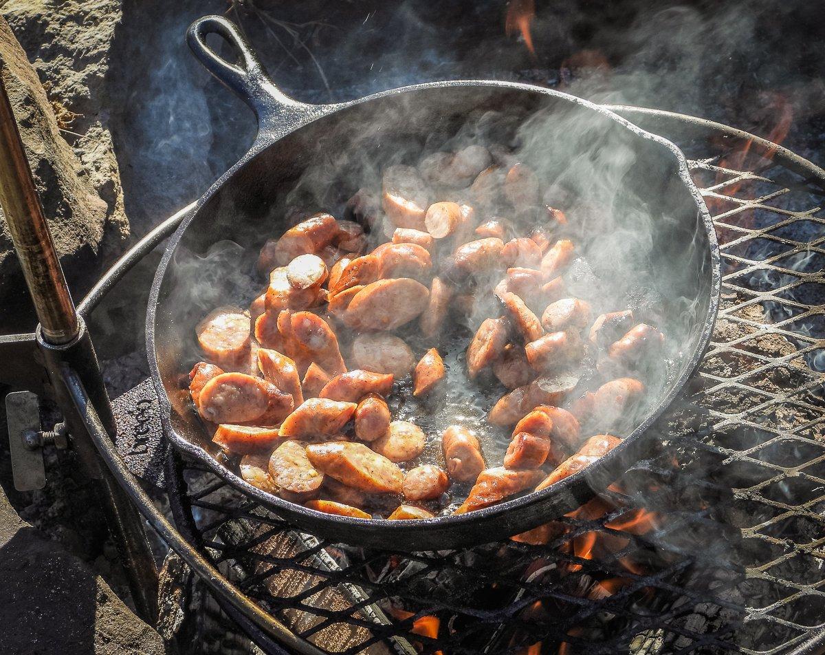 Brown the sliced sausage to render some fat into the pan.