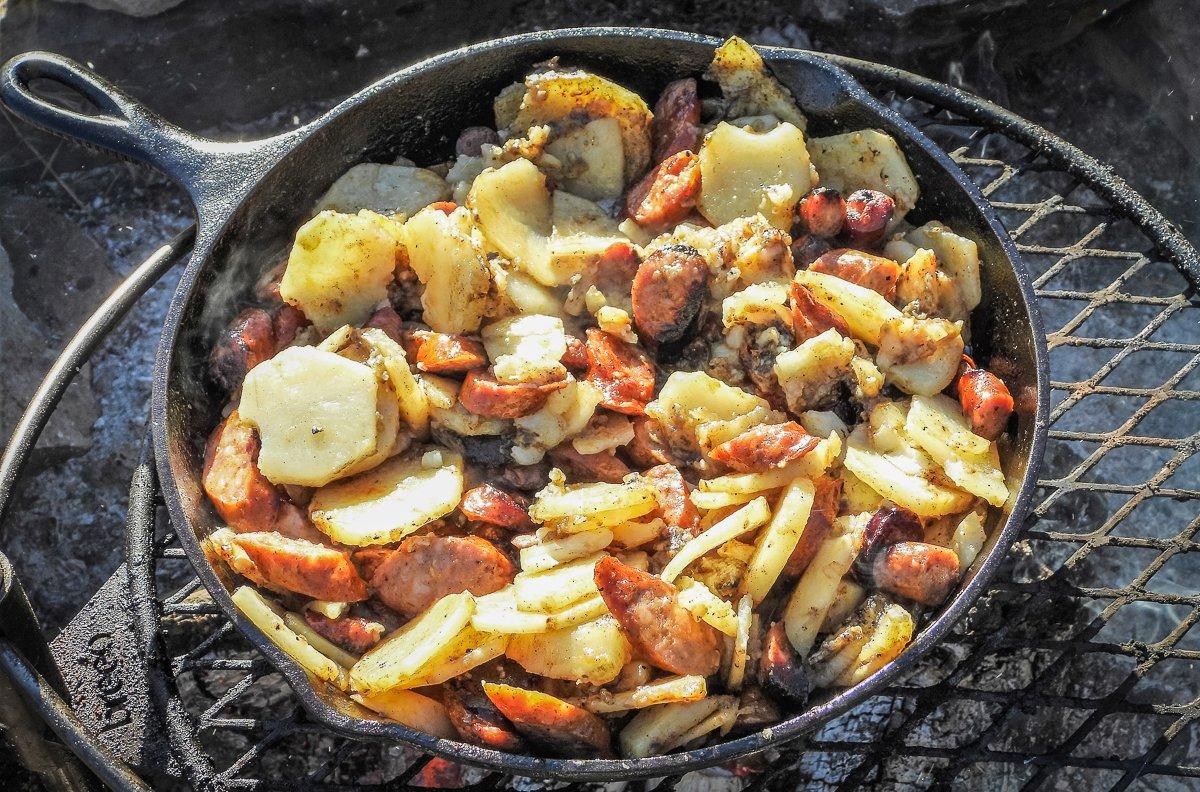 After frying the potatoes in the rendered sausage fat, return the sliced sausage to the skillet and stir to combine.