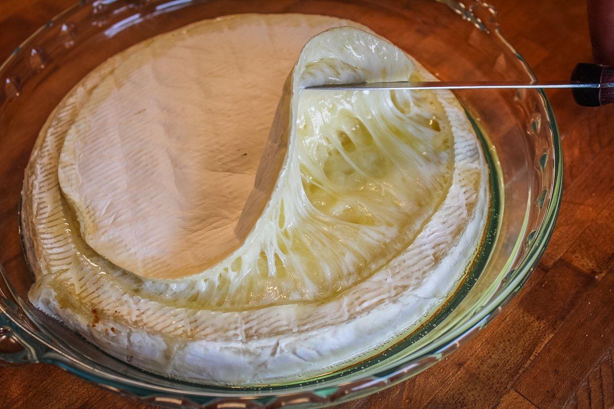 Make a shallow cut around the top of the brie and peel away the skin after it bakes.