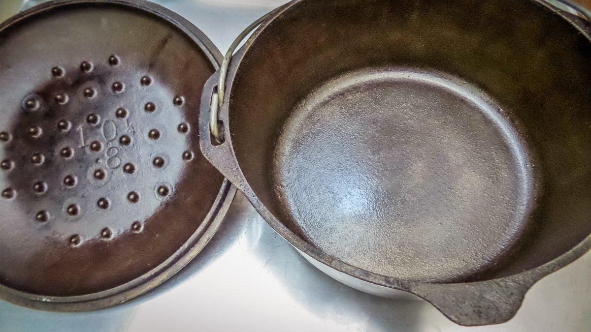 Even after cleaning and restoration, the seasoning layer on a cast iron pan will continue to darken with age.