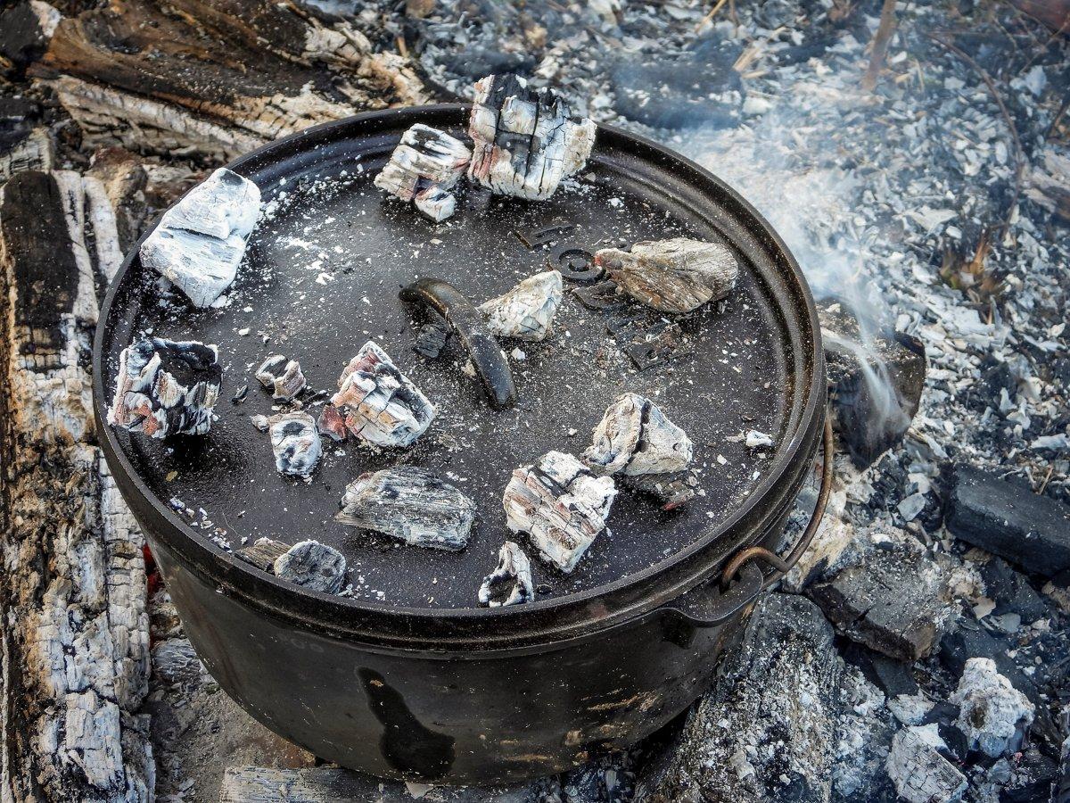 Why do some people put coals in the lid of a Dutch oven whilst