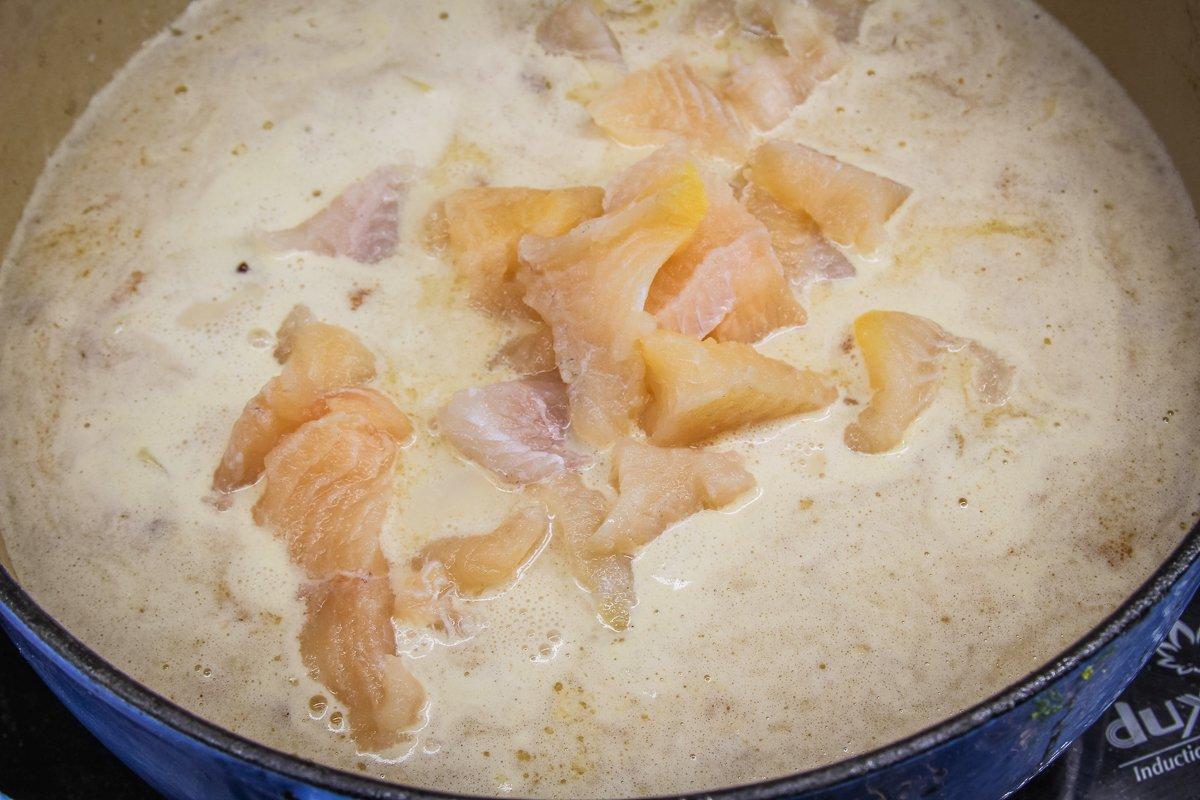 Add the fish and cream, then continue to simmer.