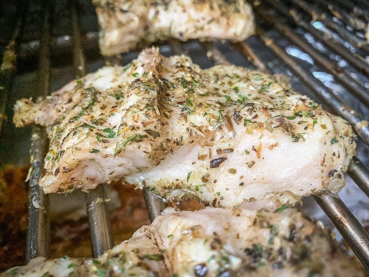 Grill the fish until the meat is white and flaky. 