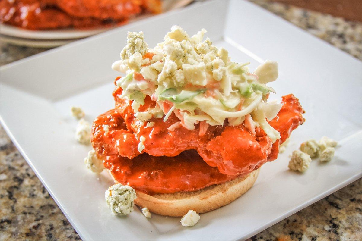 Pile the catfish on a nice bun and top with creamy cole slaw and blue cheese crumbles.