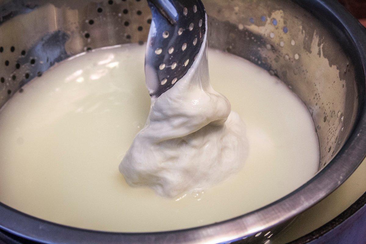 Reheat the cheese in the warm whey as you stretch it.