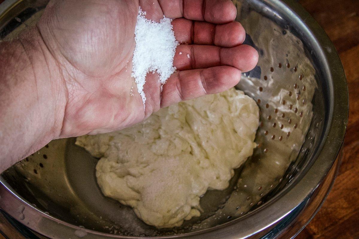 Add salt to the warm cheese as your work and stretch it.