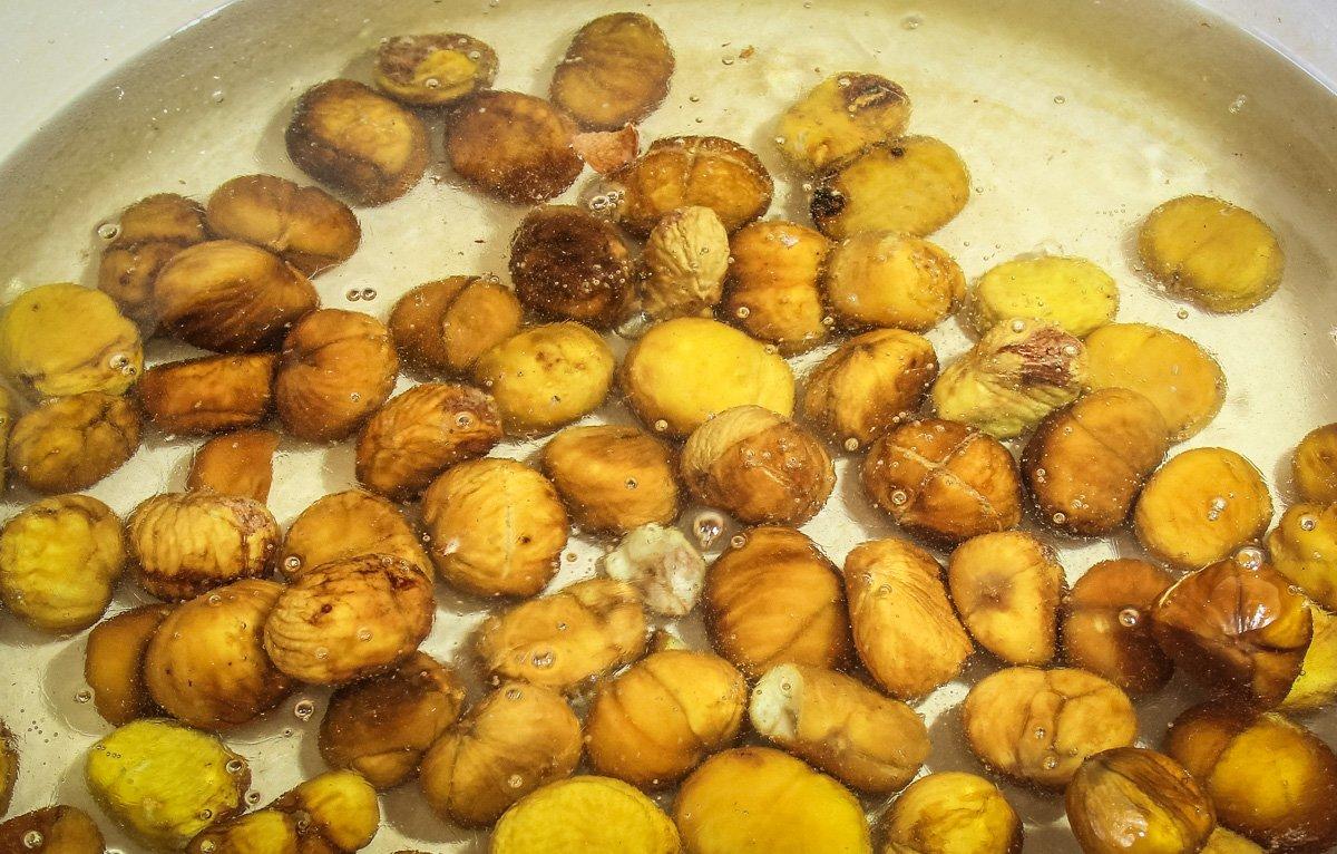 Simmer the chestnuts in the sugar water mixture.