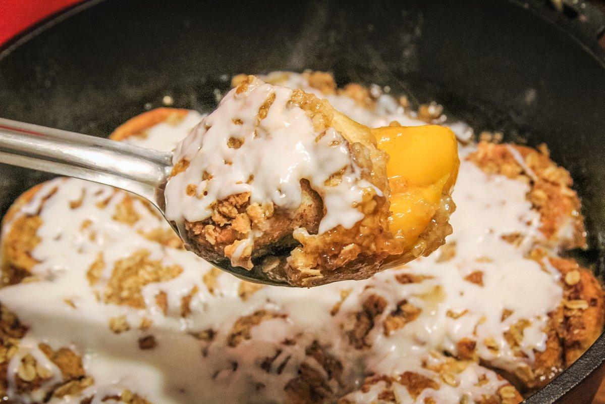 The perfect combination of gooey cinnamon rolls and peach cobbler.