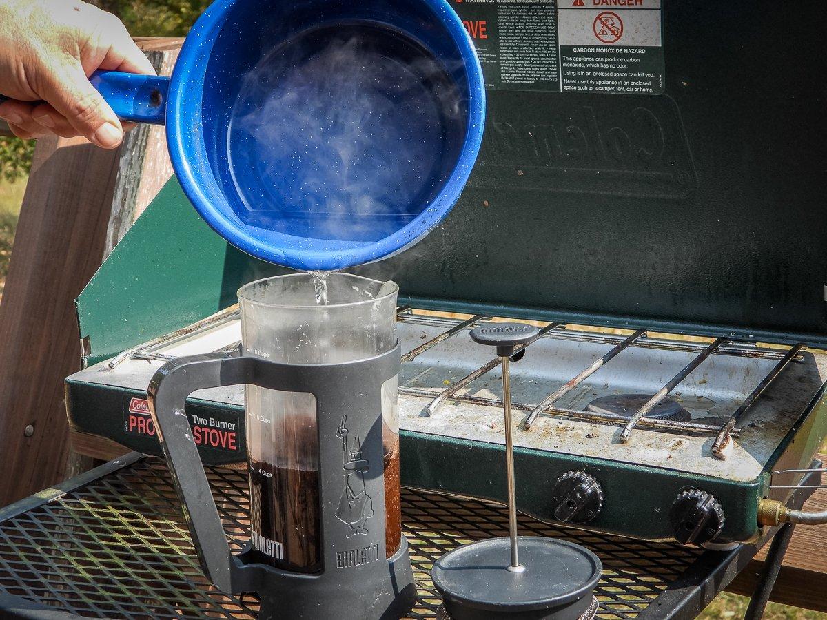 Slowly pour hot water into your French press to soak the grounds.