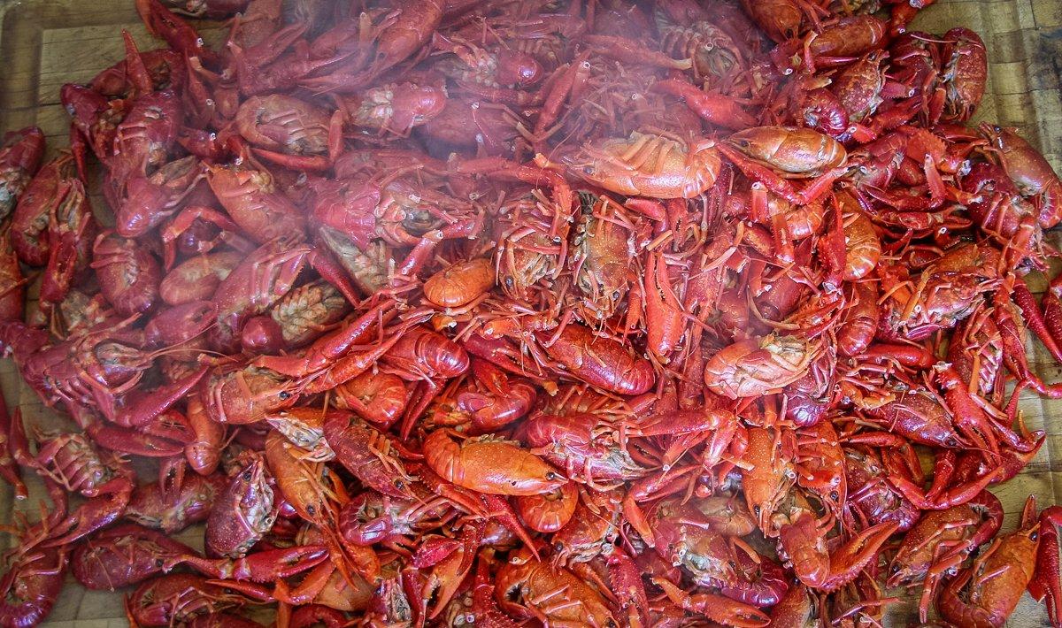 Not much makes us happier than a steaming pile of spicy crawfish.