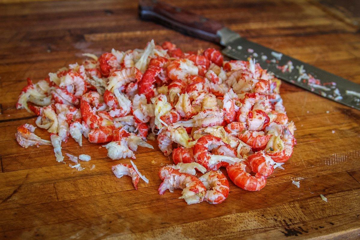 Peel the crawfish tails and give the meat a light chop before mixing the burgers.