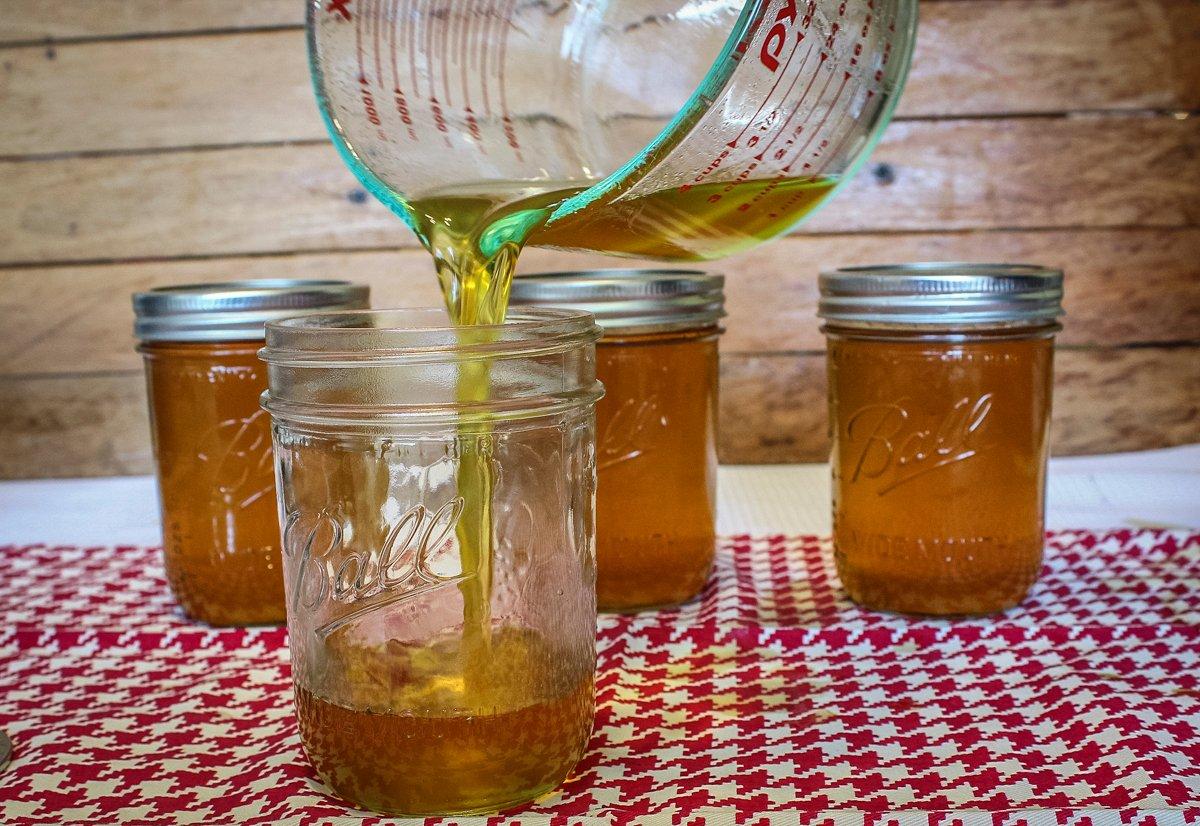 Pour the hot jelly into sterilized jars.