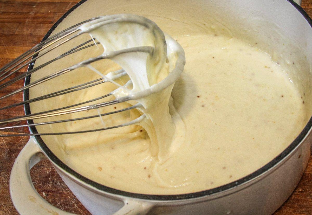 Stir in the milk and cheese and stir until smooth.