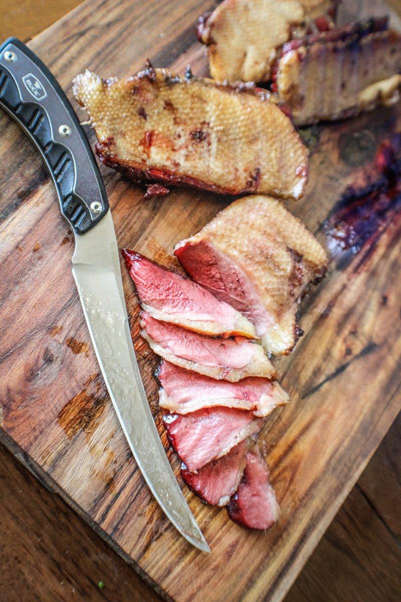 Slice the medium-rare duck breast thinly against the grain for extra tender meat.