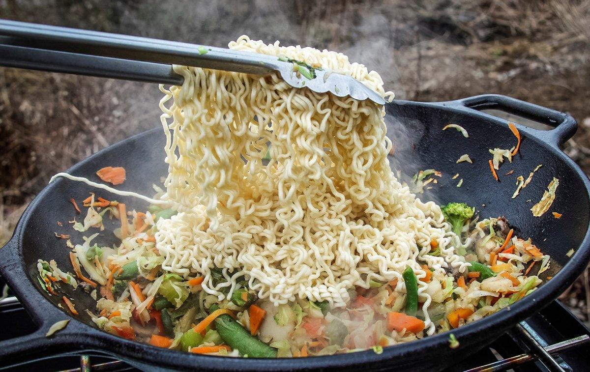 Layer the softened noodles over the vegetables and allow to steam for a minute or two before stirring them in.