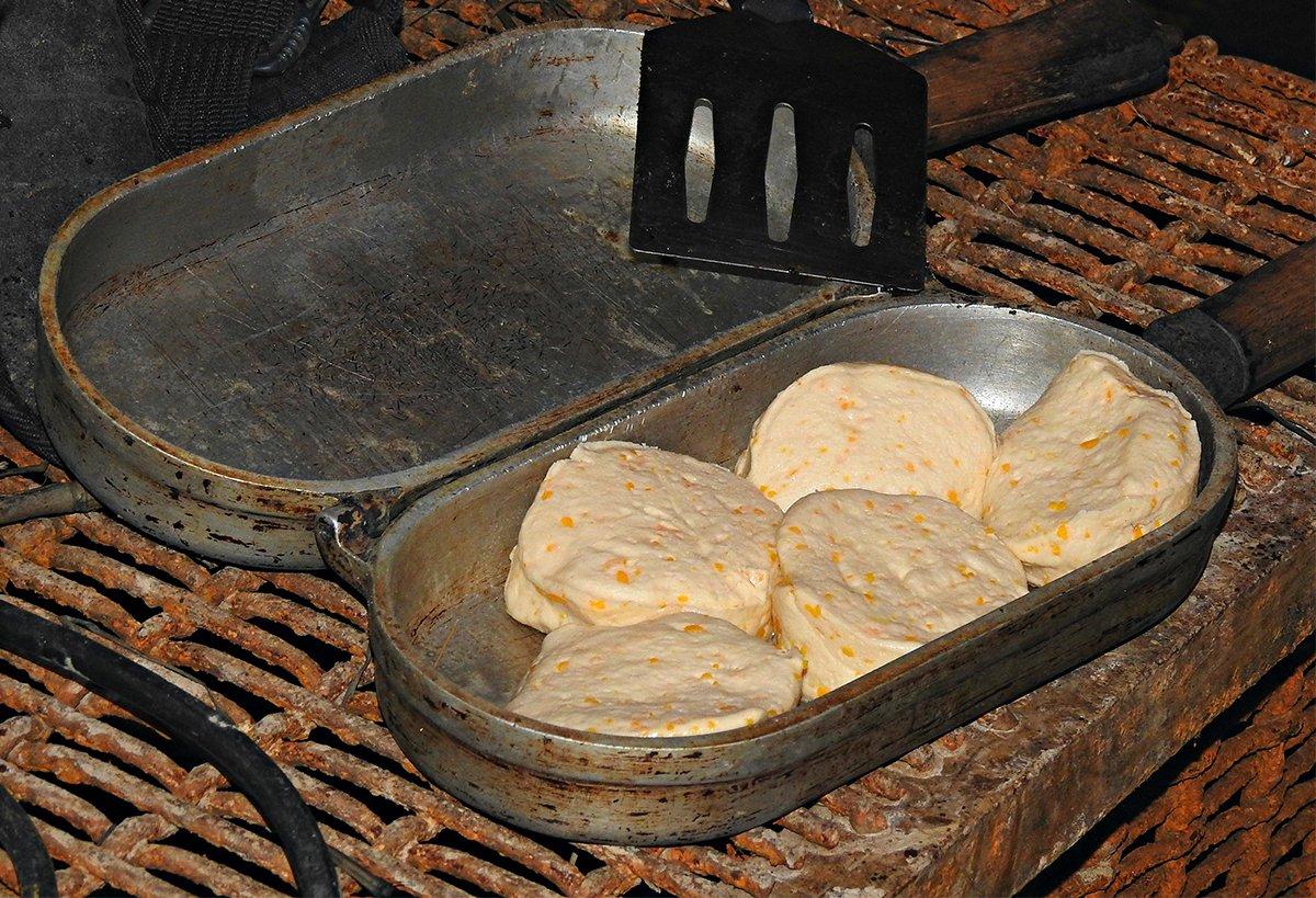 An antique fish poaching pan makes for a very serviceable biscuit cooker in the blind. 