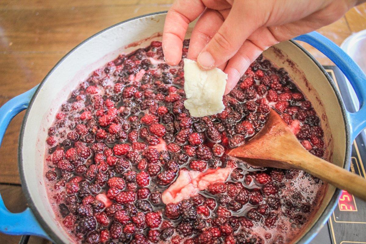 Drop the dumplings one at a time into the boiling berry mixture.