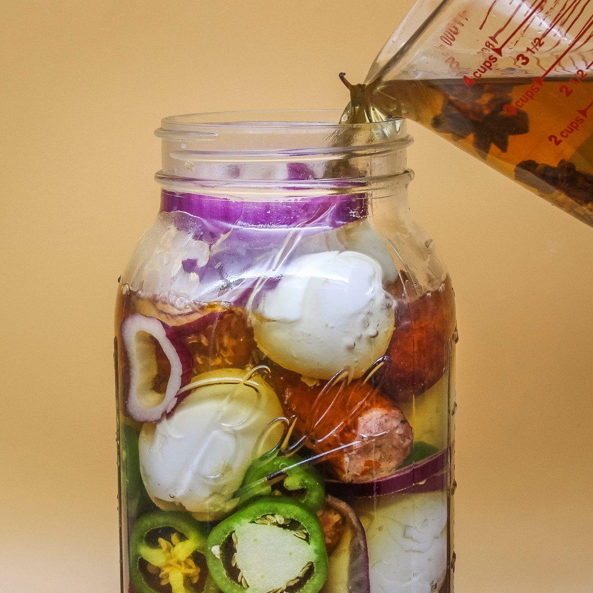 Fill the jar and pour over the brine.