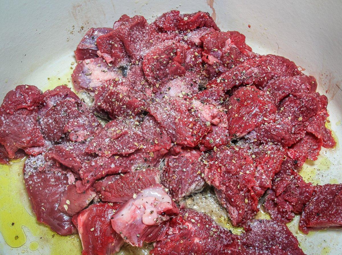 Salt and pepper the stew meat, then brown it in olive oil. 