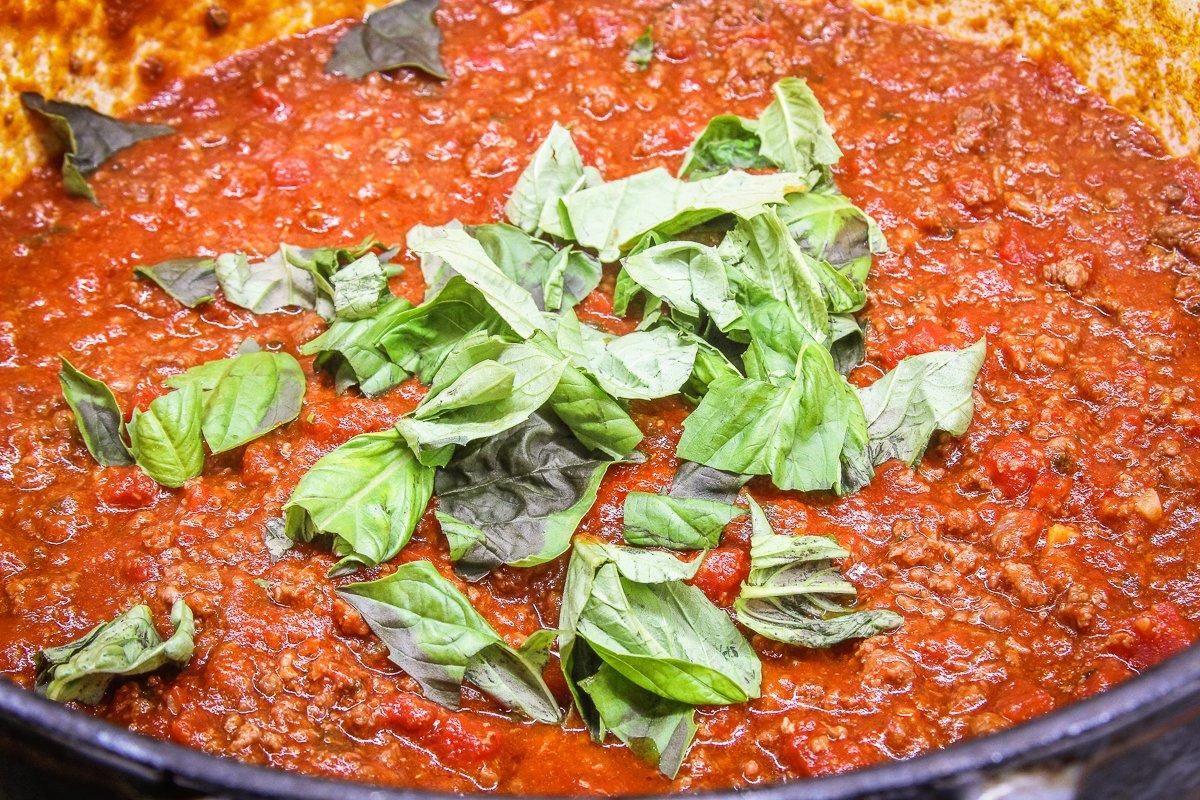 Simmer the sauce for at least an hour, then toss in the fresh basil.