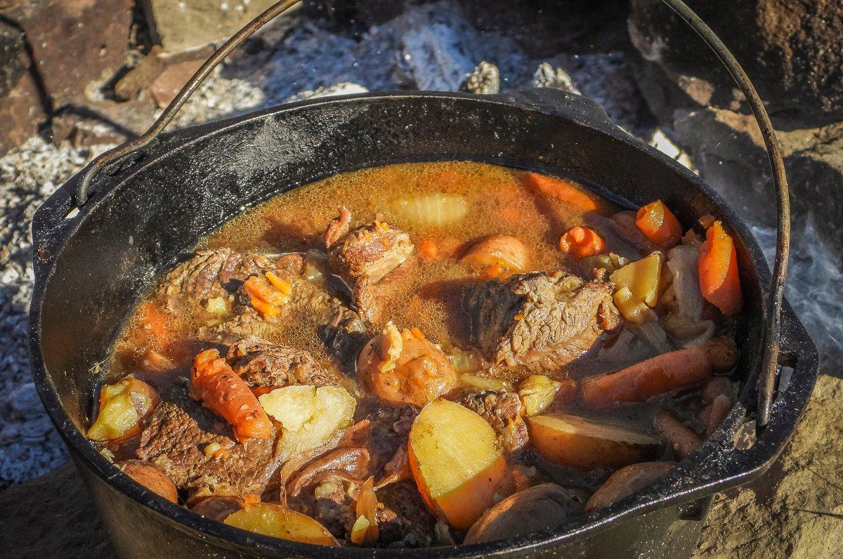 Slowly simmer the roast until the meat and vegetables are tender.