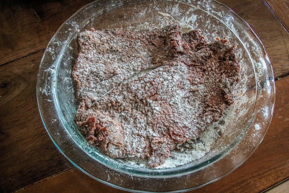 Dredge the elk in seasoned flour.