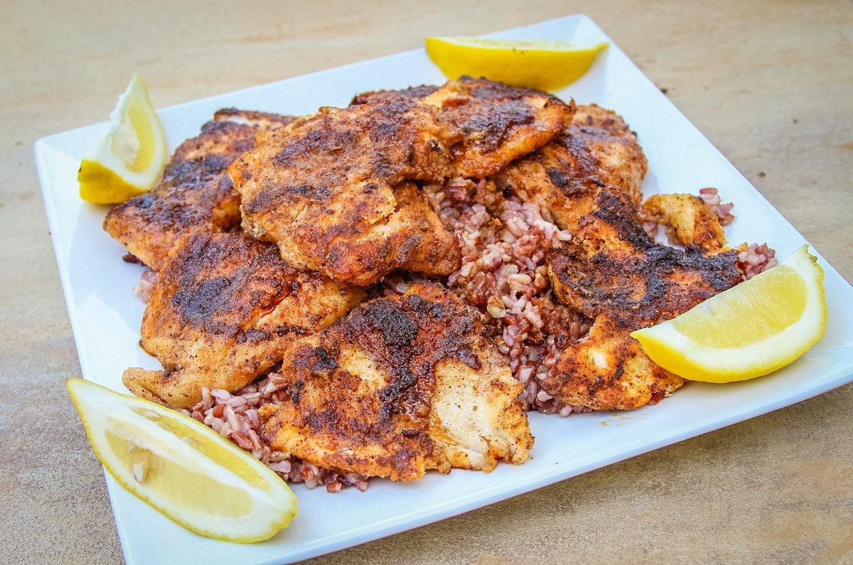 Serve the blackened catfish over rice and with lemon wedges to squeeze.