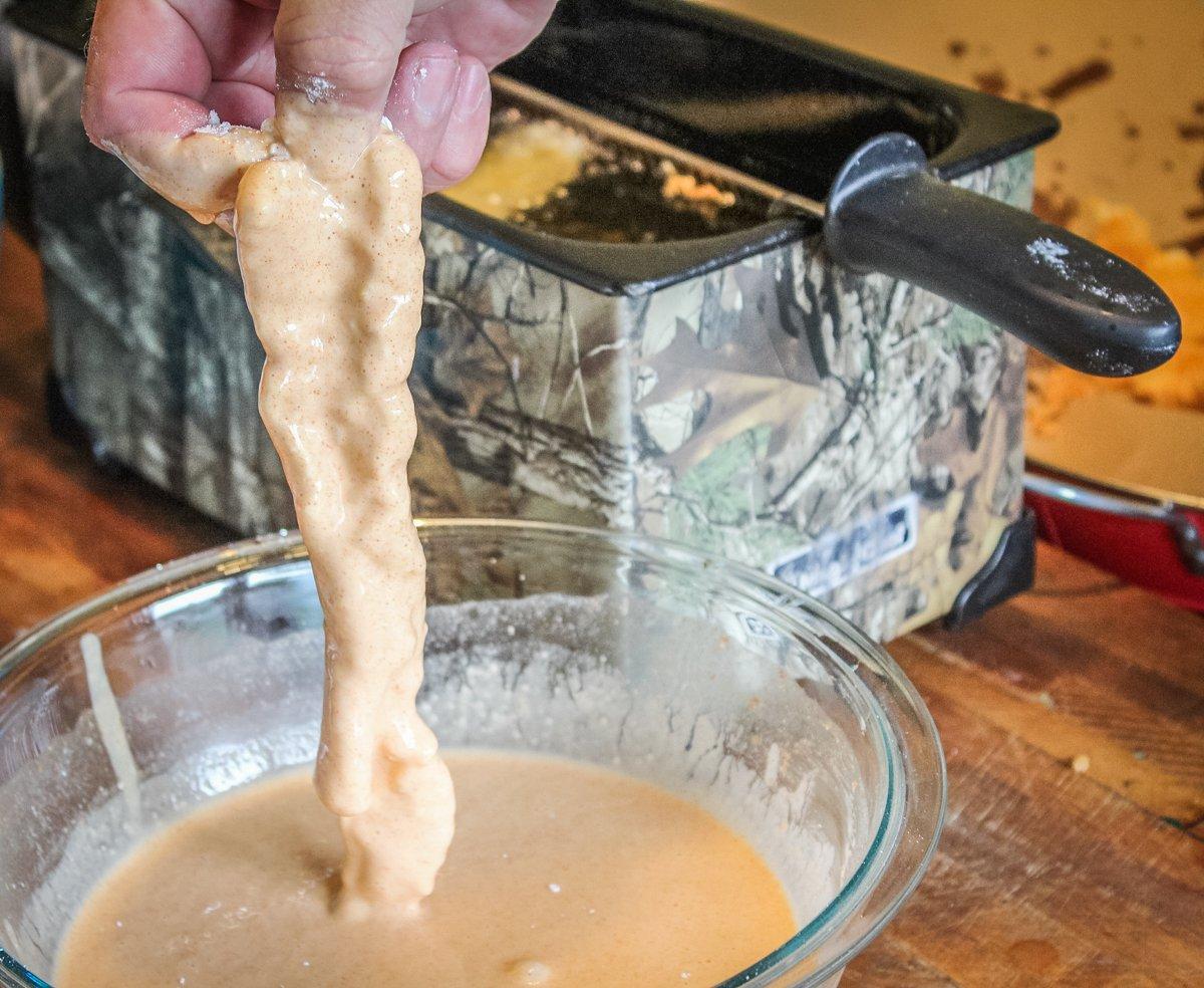 Dip the dredged fillets into the batter before dropping into hot oil.