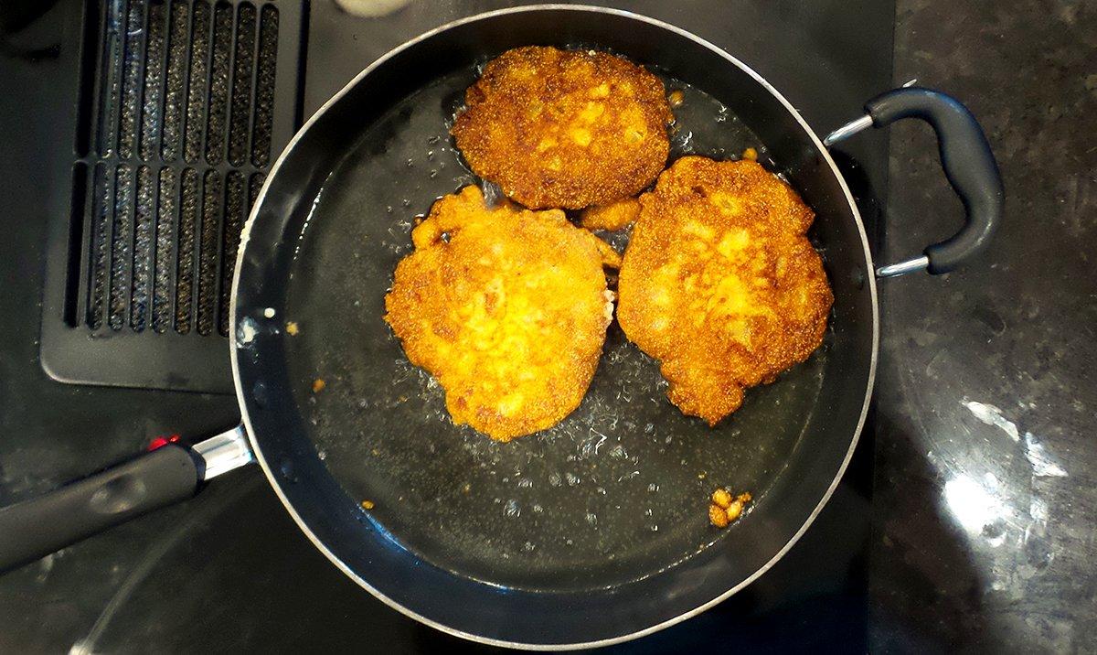 Fry the cornbread cakes until crisp and golden on both sides.