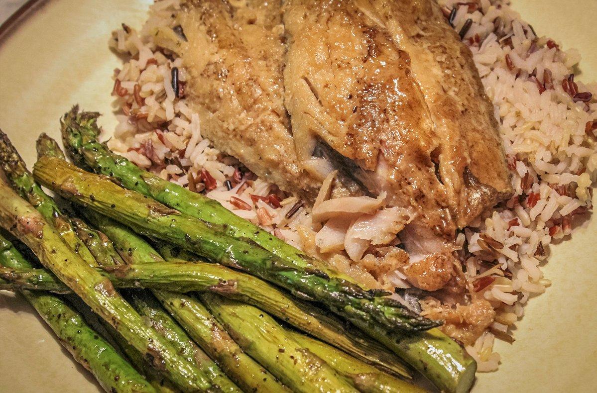 Serve the grilled fish over rice with a green vegetable for a fresh, full meal.