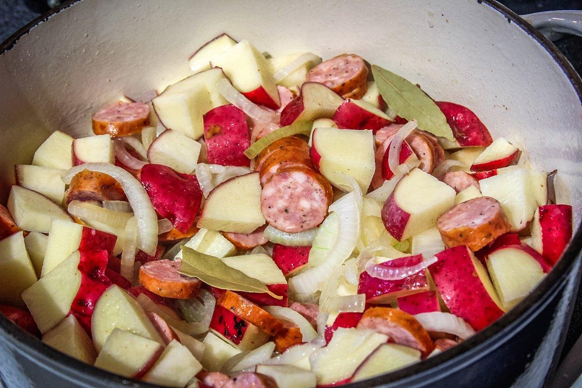 Saute the potatoes, onions, and sausage in the bacon grease.