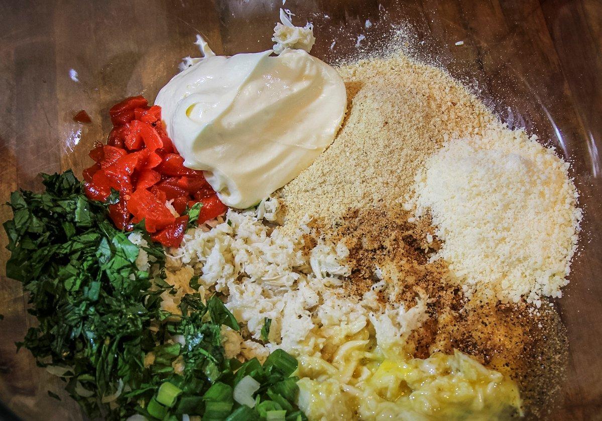 Blend the crab meat stuffing ingredients in a large bowl.