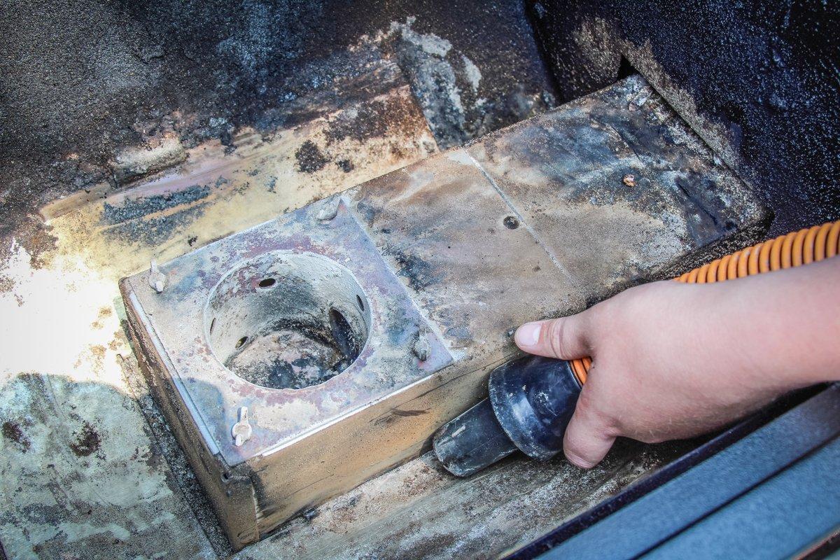 Use a vacuum to remove ash from the interior of your pellet grill.