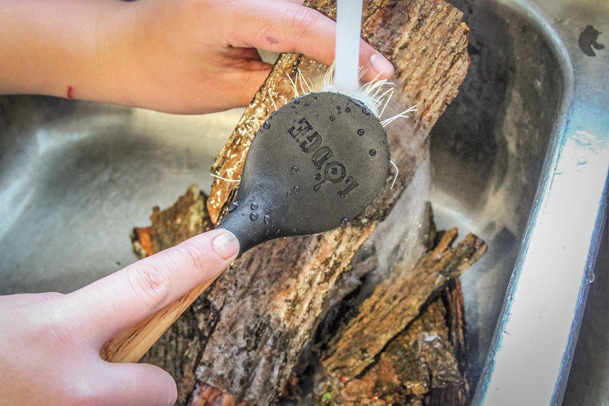 Use a stiff bristle brush and running water to clean the bark well.